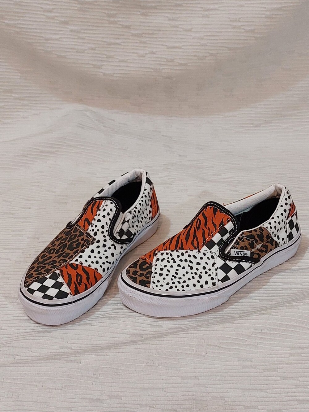 Vans Kids Slip-On Patchwork Animal Print Sneakers in Orange/Black/White Size 2
